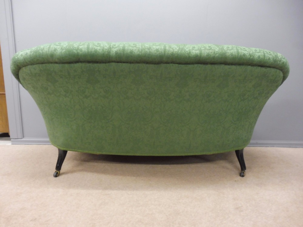 CHARMING CURVED VICTORIAN SOFA ON EBONISED LEGS CIRCA 1890  View VI