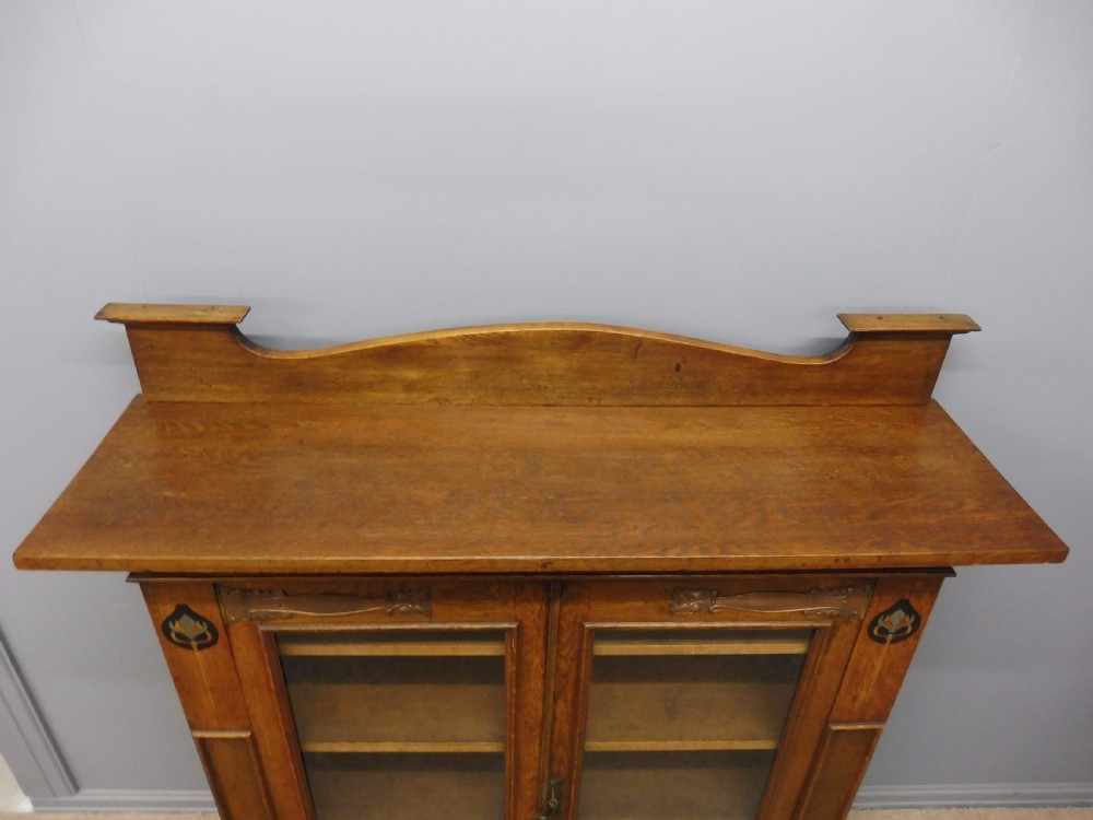 STUNNING ARTS AND CRAFTS OAK INLAID GLAZED BOOKCASE CIRCA 1900 View V
