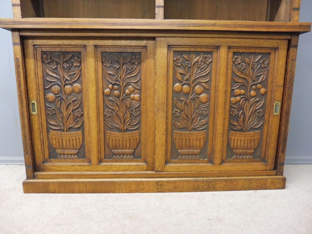 LARGE OAK OPEN TOP BOOKCASE WITH CARVED FRUIT TREE DOORS CIRCA 1900 View V