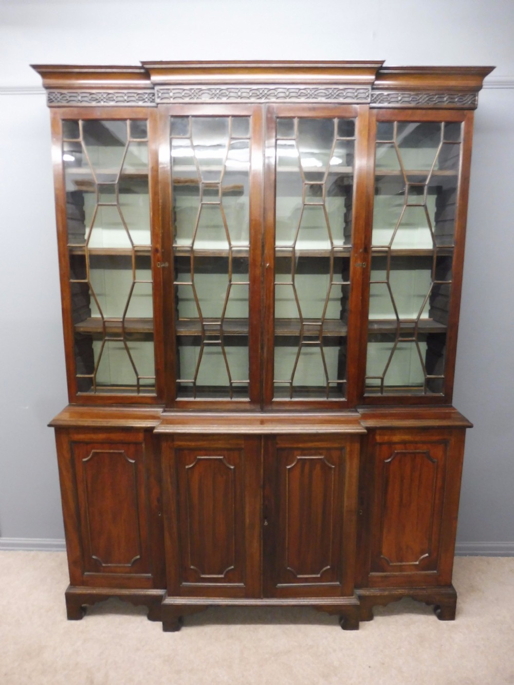 VICTORIAN MAHOGANY BREAKFRONT GLAZED BOOKCASE CIRCA 1900