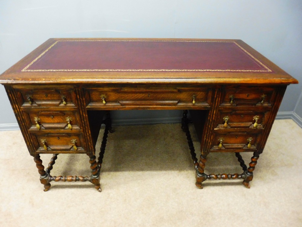 EDWARDIAN OAK PEDESTAL DESK WITH INSET TOOLED LEATHER