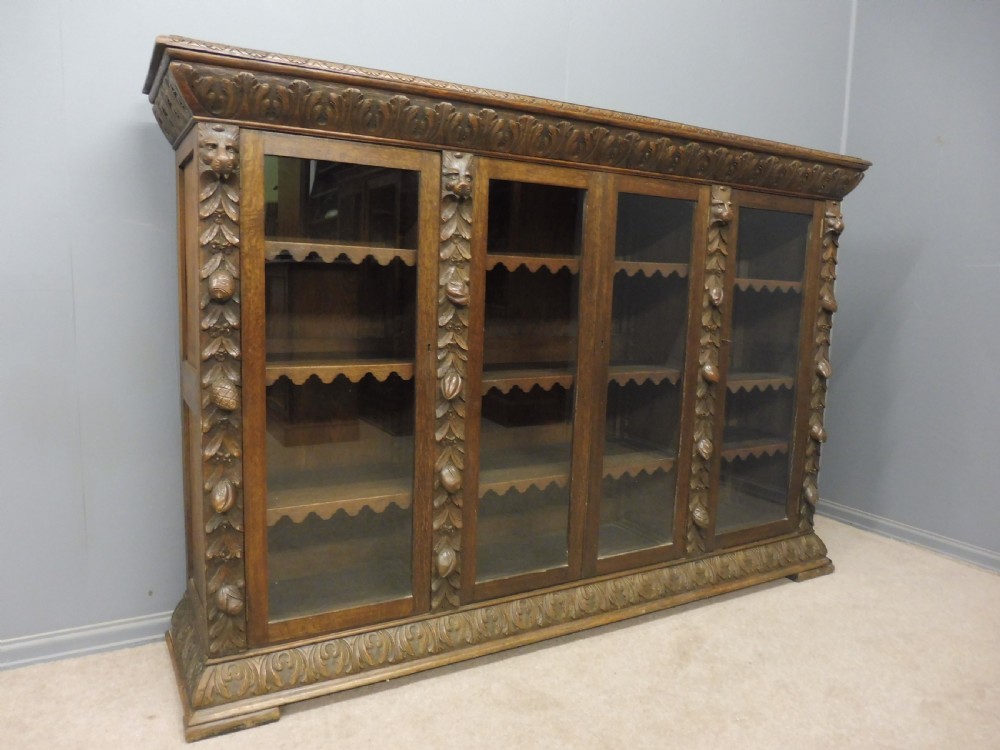 CARVED OAK 4 DOOR BOOKCASE CIRCA 1890
