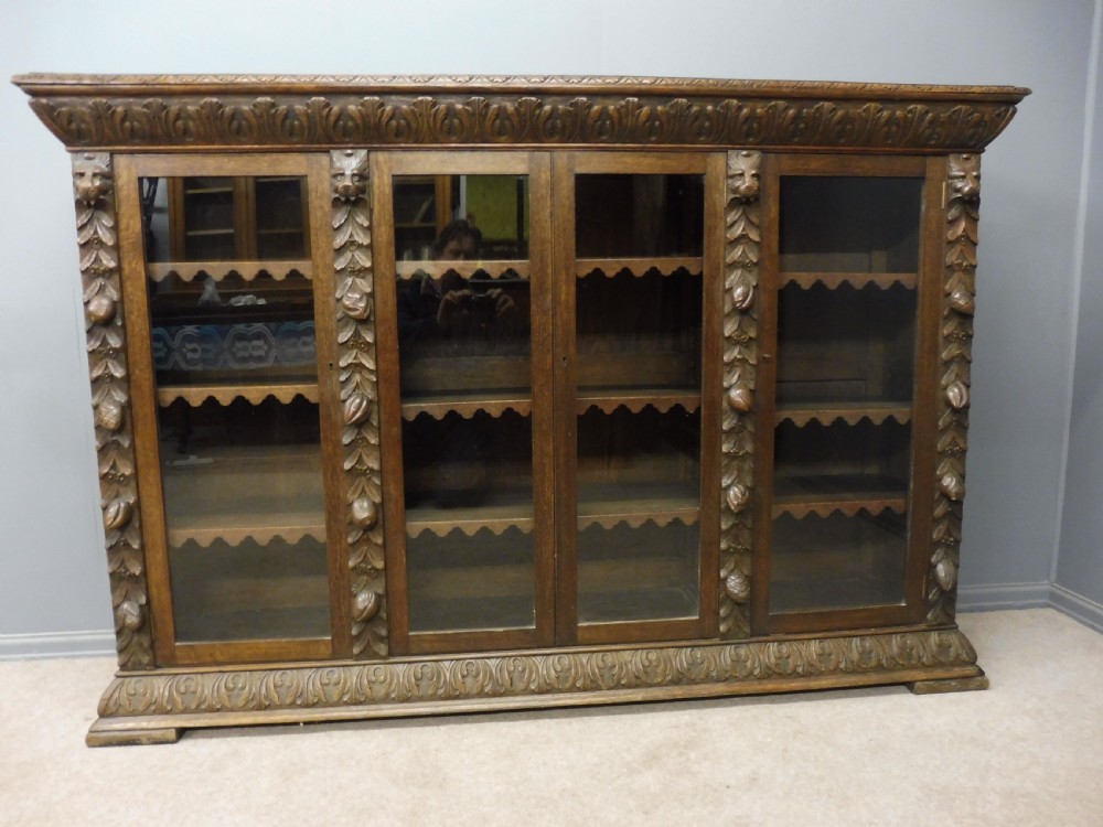 CARVED OAK 4 DOOR BOOKCASE CIRCA 1890 View II