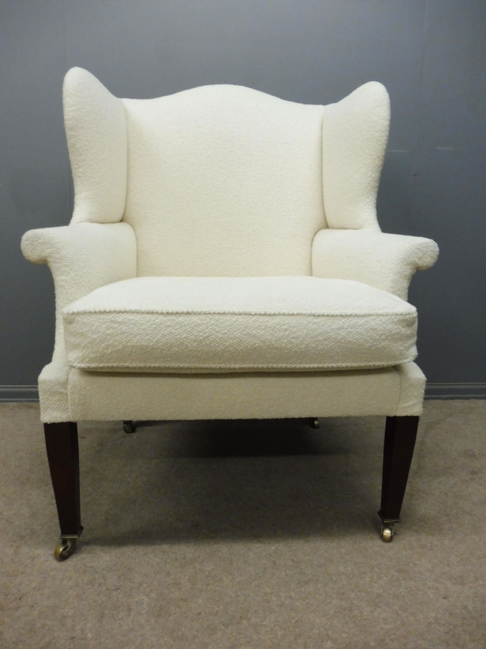 GENEROUSLY SIZED ANTIQUE WINGED ARMCHAIR CIRCA 1900 View II