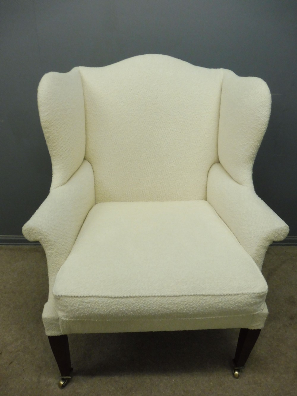 GENEROUSLY SIZED ANTIQUE WINGED ARMCHAIR CIRCA 1900 View III