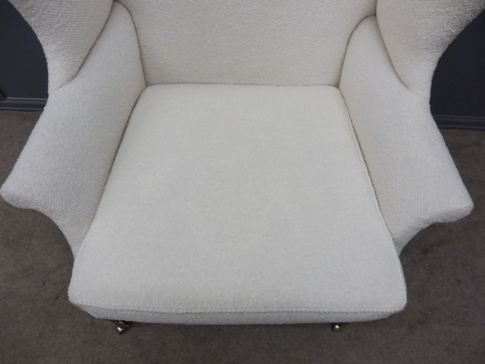 GENEROUSLY SIZED ANTIQUE WINGED ARMCHAIR CIRCA 1900 View V