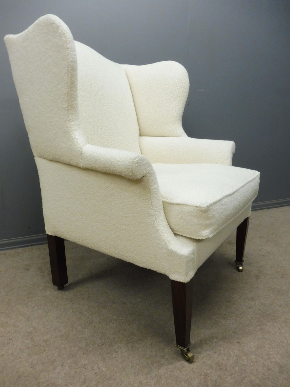 GENEROUSLY SIZED ANTIQUE WINGED ARMCHAIR CIRCA 1900 View X