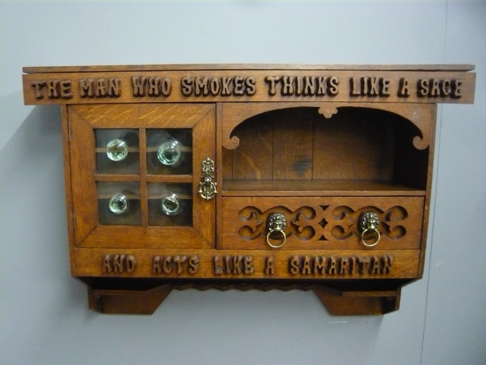 ARTS AND CRAFTS CARVED OAK GLAZED WALL CABINET 1910