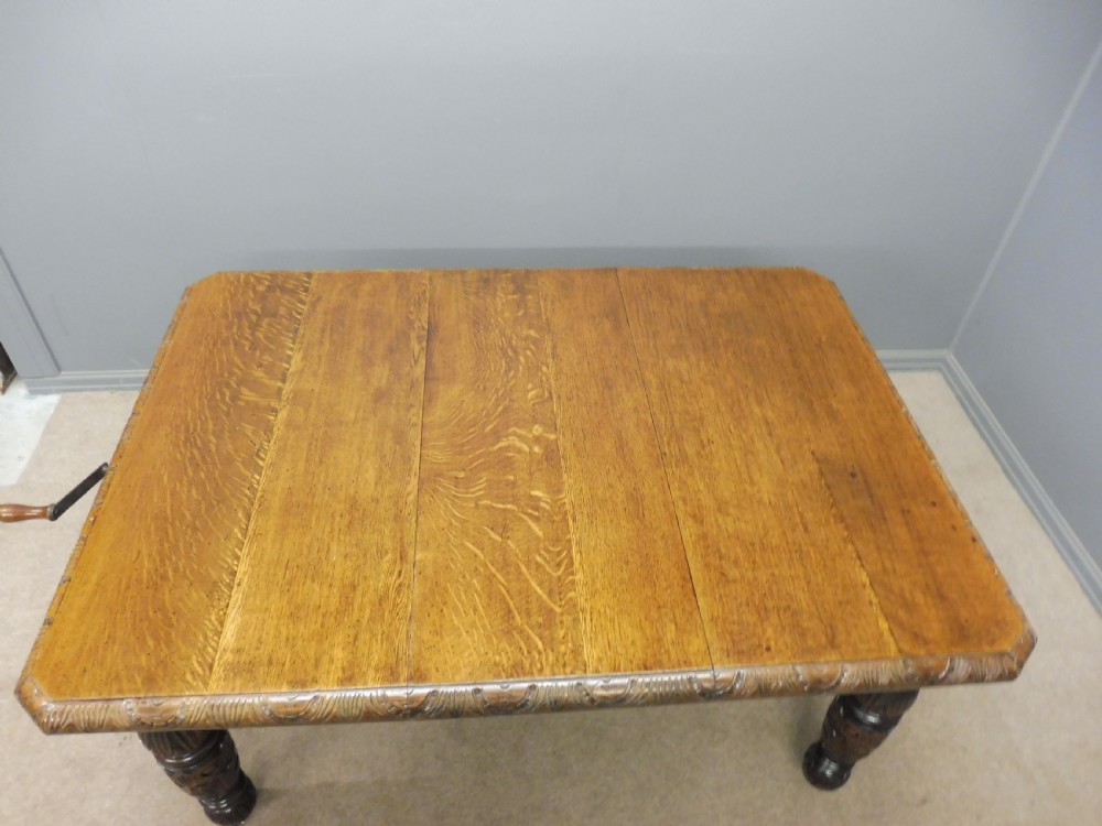 SMALL VICTORIAN CARVED OAK EXTENDING DINING TABLE View II