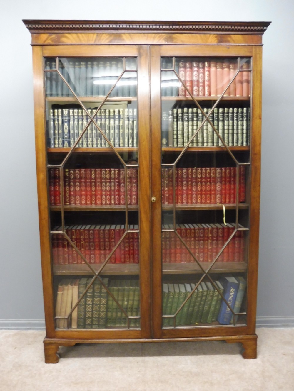 EDWARDIAN MAHOGANY GLASS FRONTED BOOKCASE