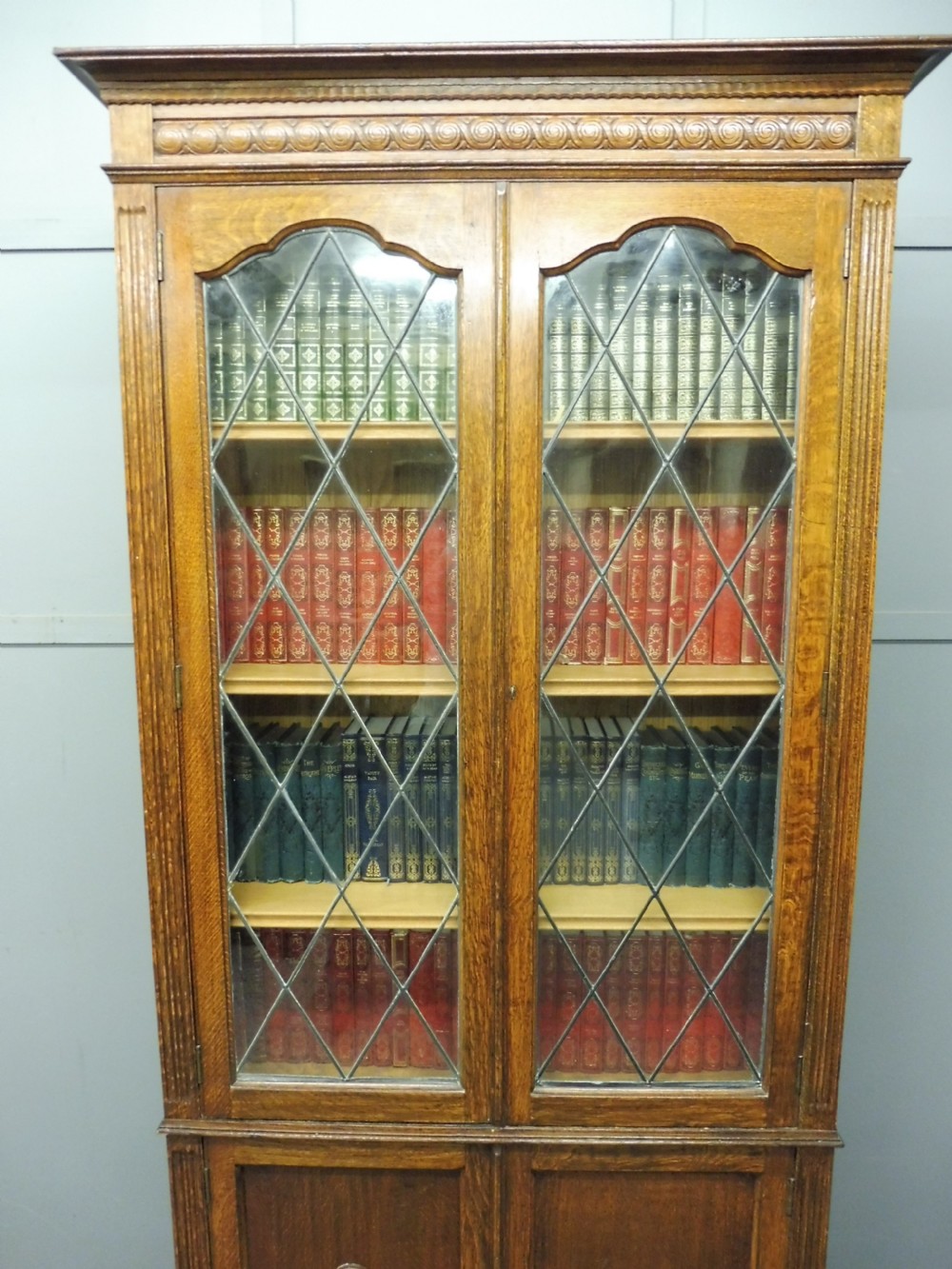 OAK BOOKCASE WITH LEADED GLASS DOORS View V