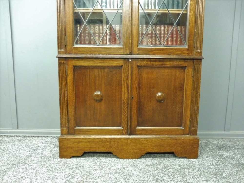 OAK BOOKCASE WITH LEADED GLASS DOORS View IX