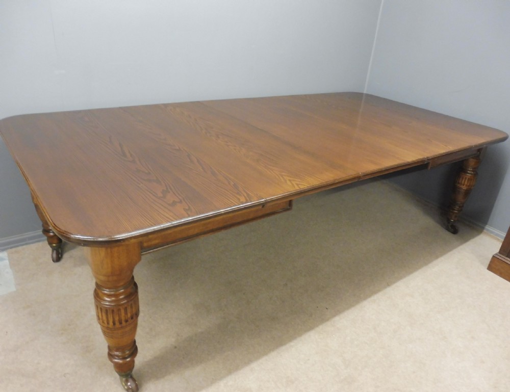 LARGE VICTORIAN OAK EXTENDING DINING TABLE View IX
