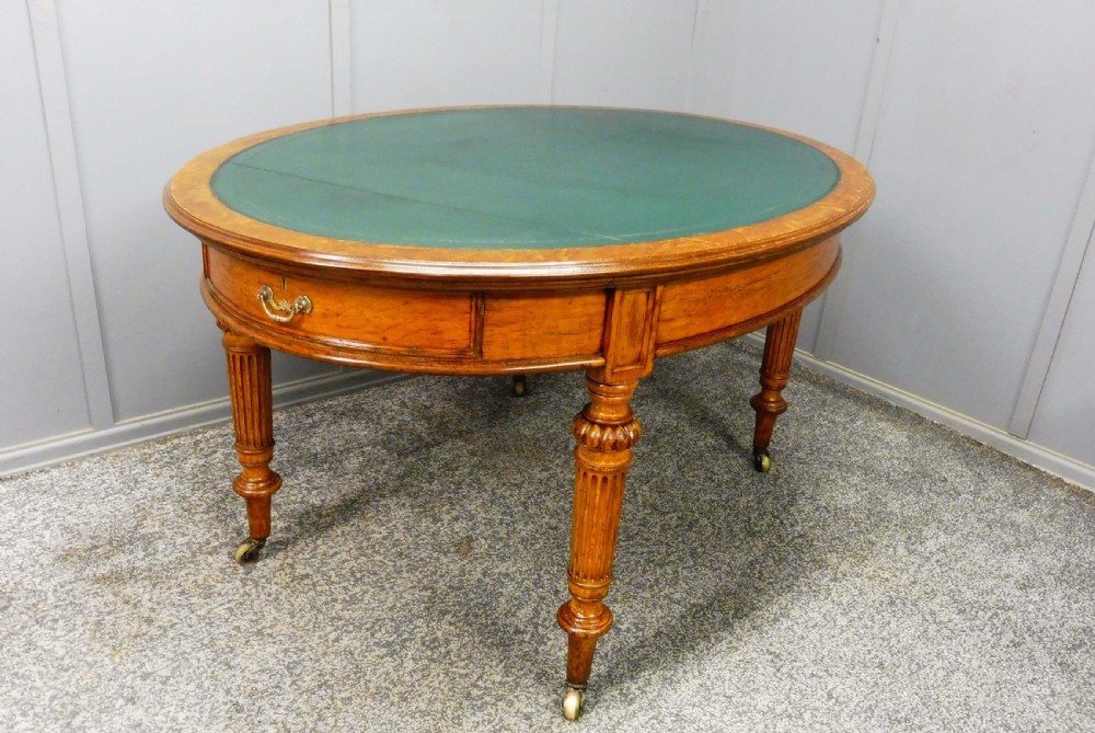 MID 19TH CENTURY OVAL OAK LIBRARY WRITING TABLE