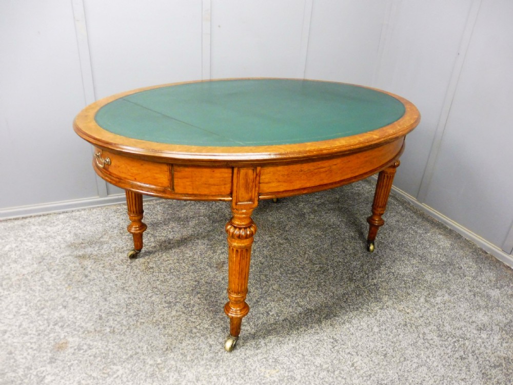MID 19TH CENTURY OVAL OAK LIBRARY WRITING TABLE View III