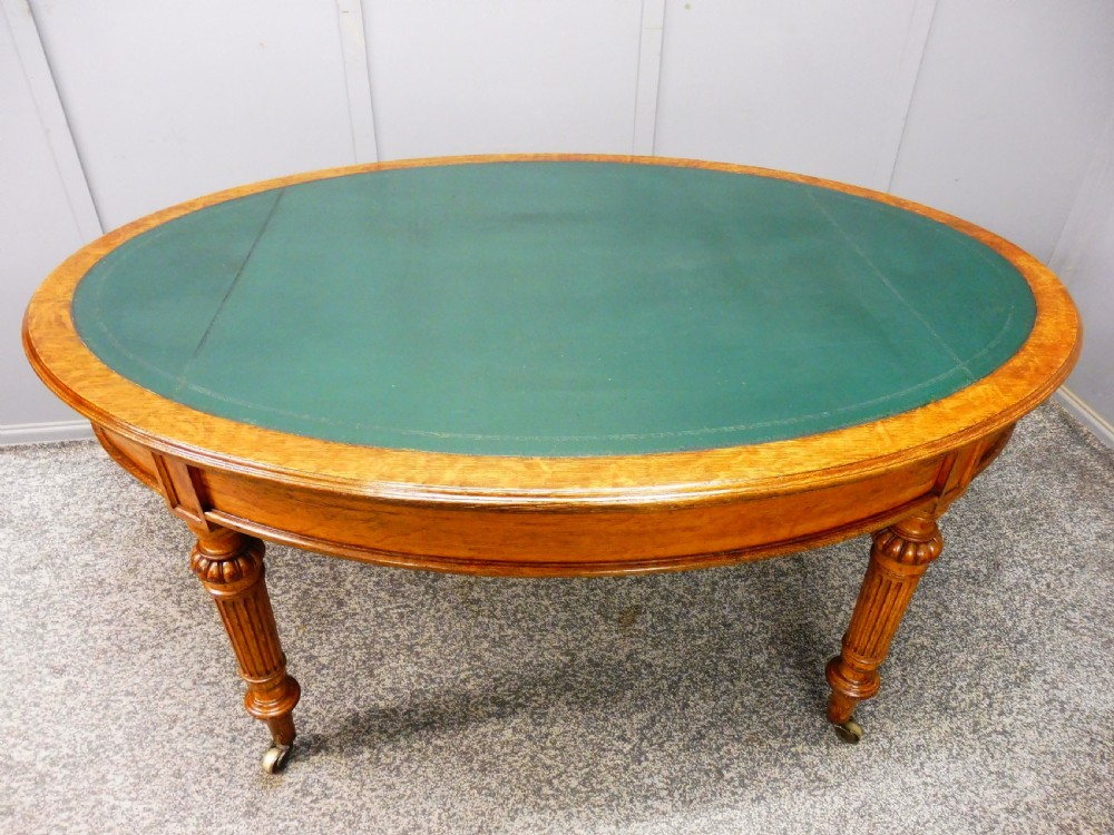 MID 19TH CENTURY OVAL OAK LIBRARY WRITING TABLE View VII