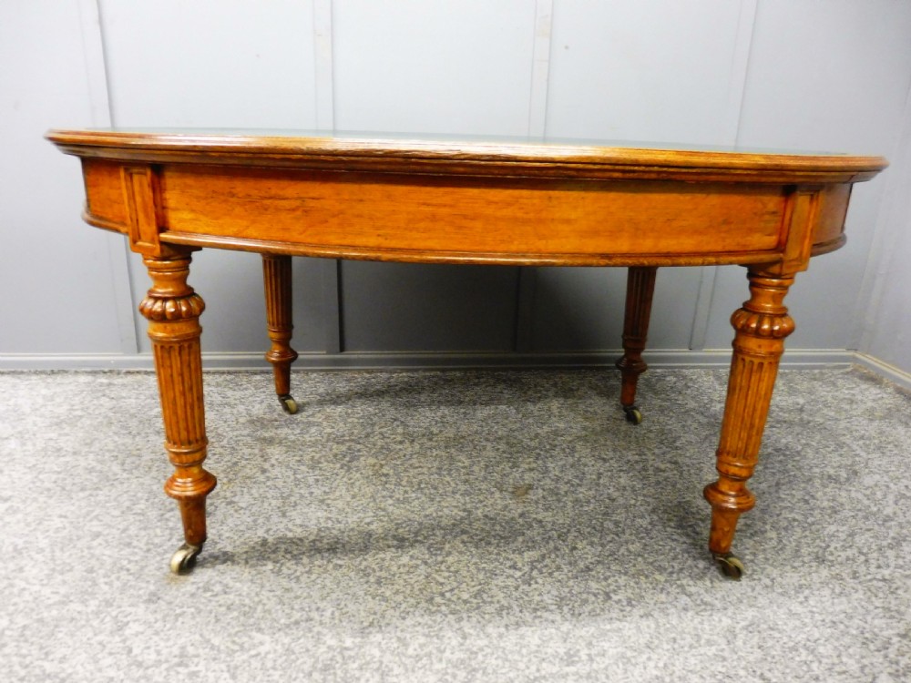 MID 19TH CENTURY OVAL OAK LIBRARY WRITING TABLE View VIII