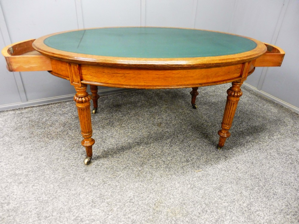 MID 19TH CENTURY OVAL OAK LIBRARY WRITING TABLE View X