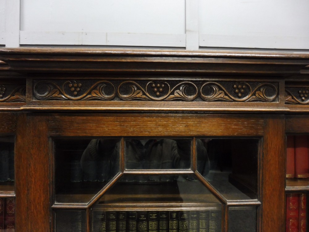 SMALL OAK BREAKFRONT BOOKCASE  View V