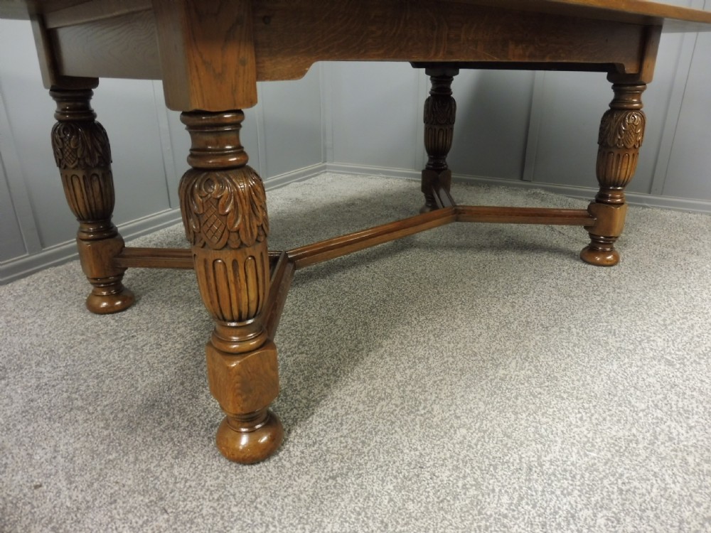 LARGE OAK DINING TABLE AND 8 CHAIRS View X