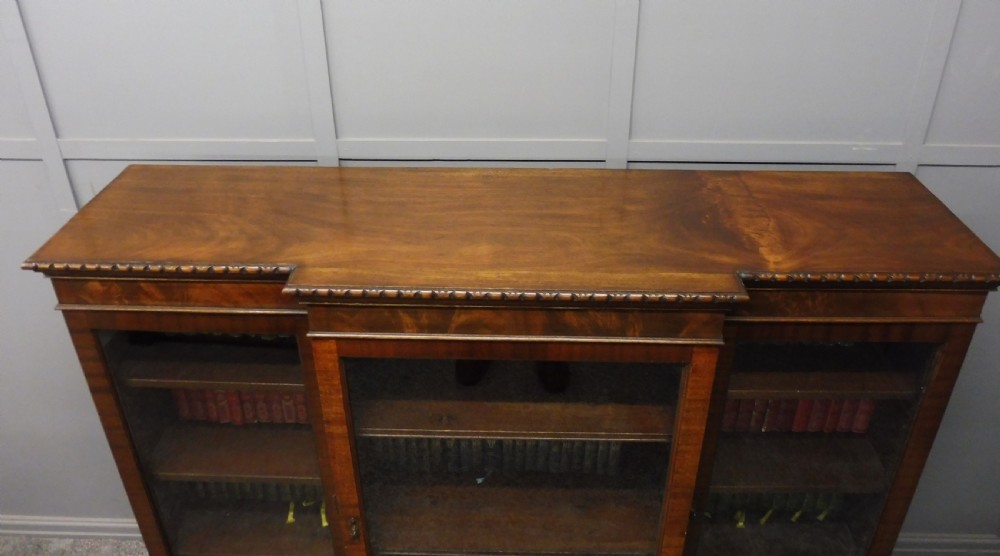 MAHOGANY BREAKFRONT BOOKCASE WITH BALL AND CLAW FEET View V