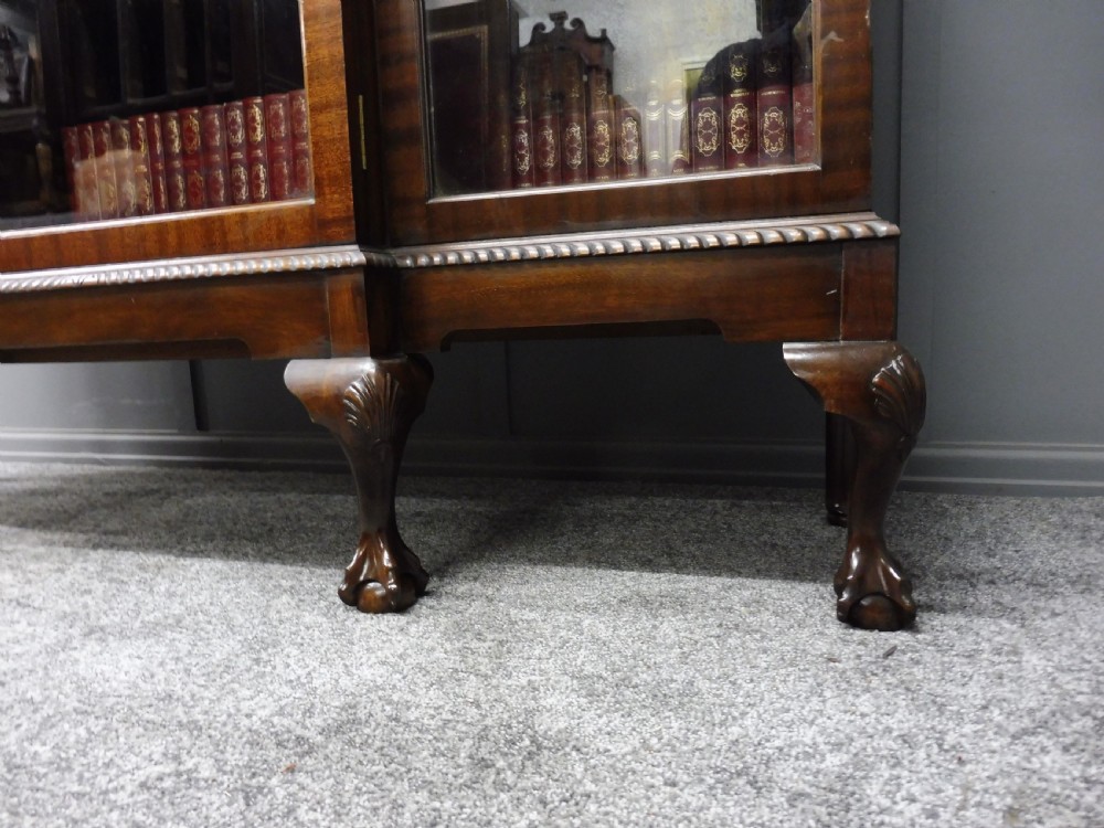 MAHOGANY BREAKFRONT BOOKCASE WITH BALL AND CLAW FEET View IX