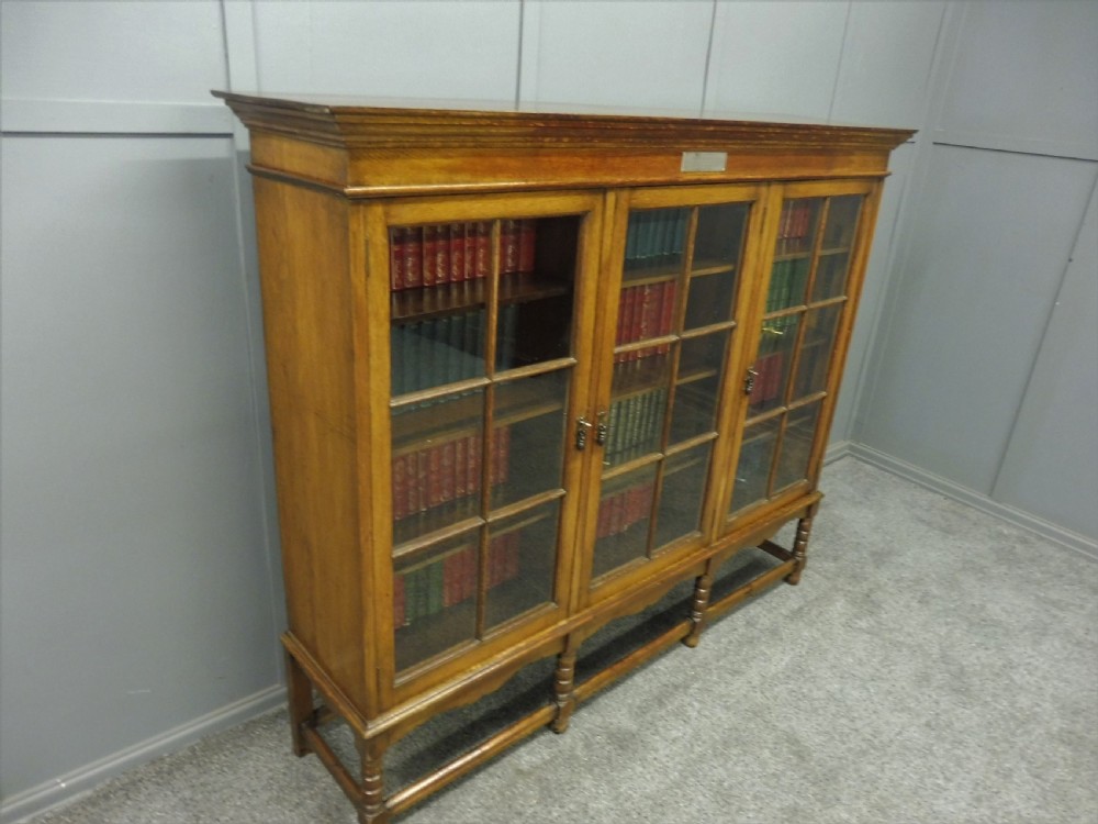 OAK 3 DOOR BOOKCASE CIRCA 1923 View VI