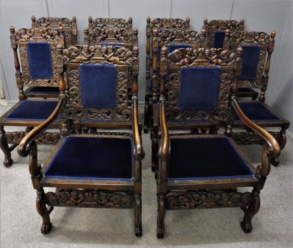 SET OF TEN CARVED WALNUT CHERUB DINING CHAIRS