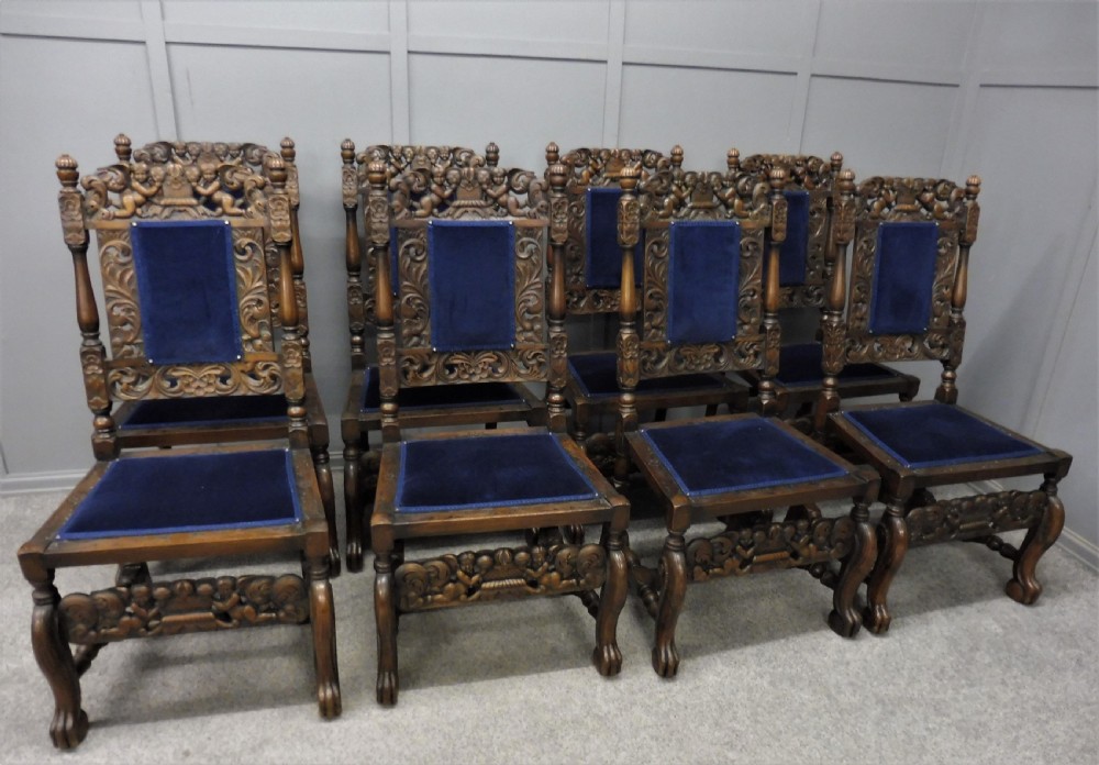 SET OF TEN CARVED WALNUT CHERUB DINING CHAIRS View V