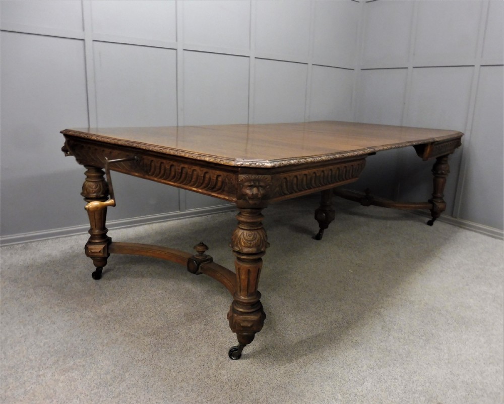 VICTORIAN CARVED OAK EXTENDING DINING TABLE CIRCA 1880 View II
