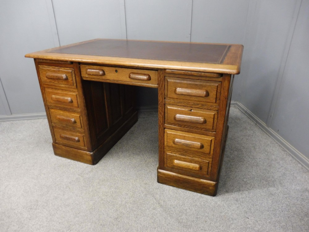 EDWARDIAN OAK LEATHER TOP DESK