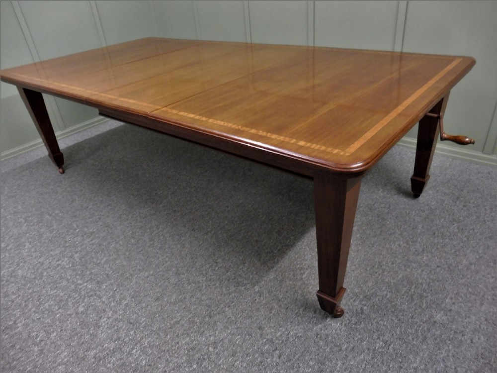 WALNUT INLAID EXTENDING DINING TABLE CIRCA 1900