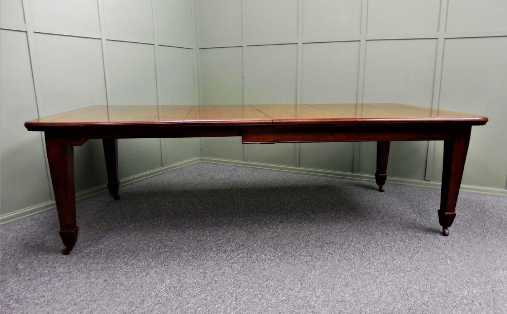 WALNUT INLAID EXTENDING DINING TABLE CIRCA 1900 View II