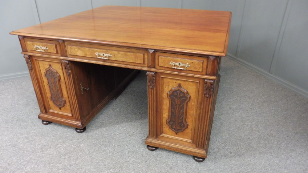 19TH CENTURY WALNUT AND MAHOGANY PARTNERS DESK