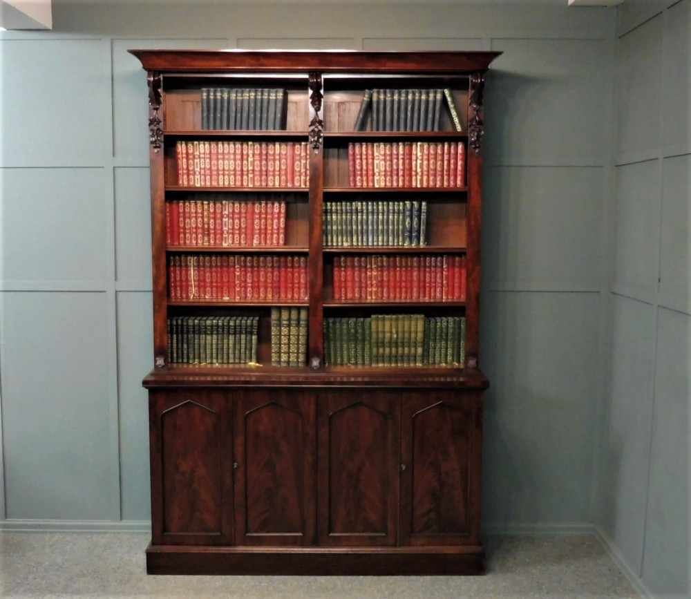 MID 19TH CENTURY MAHOGANY BOOKCASE ON CUPBOARD