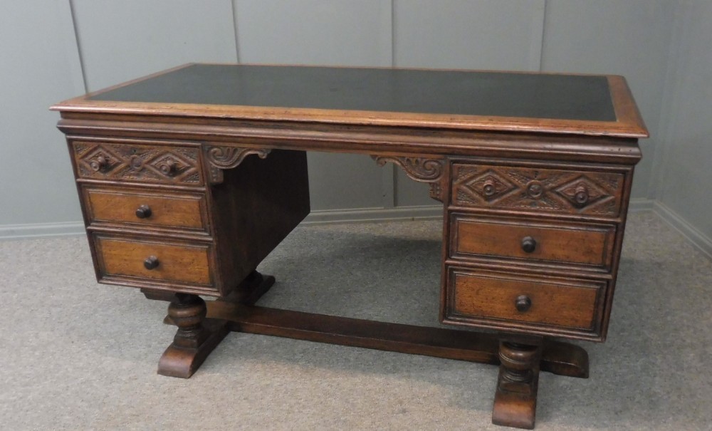 TUDOR STYLE DISTRESSED OAK PEDESTAL DESK