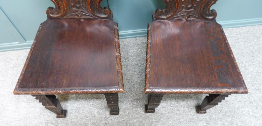 A PAIR OF 19TH CENTURY GREEN MAN HALL CHAIRS View III