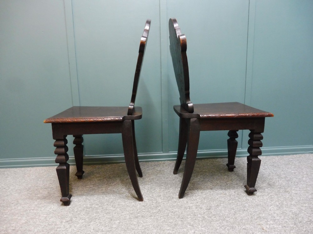 A PAIR OF 19TH CENTURY GREEN MAN HALL CHAIRS View IV