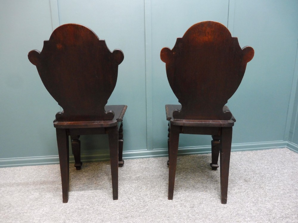 A PAIR OF 19TH CENTURY GREEN MAN HALL CHAIRS View V