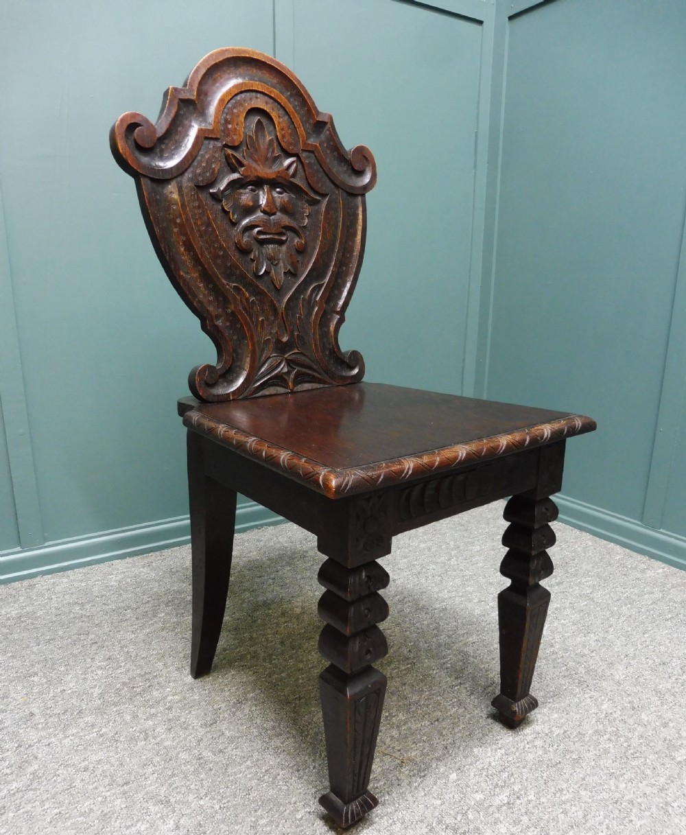 A PAIR OF 19TH CENTURY GREEN MAN HALL CHAIRS View IX