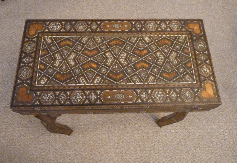 A Syrian Damascus card table featuring geometric wood and bone inlay work supported by curved cabriole legs. View II