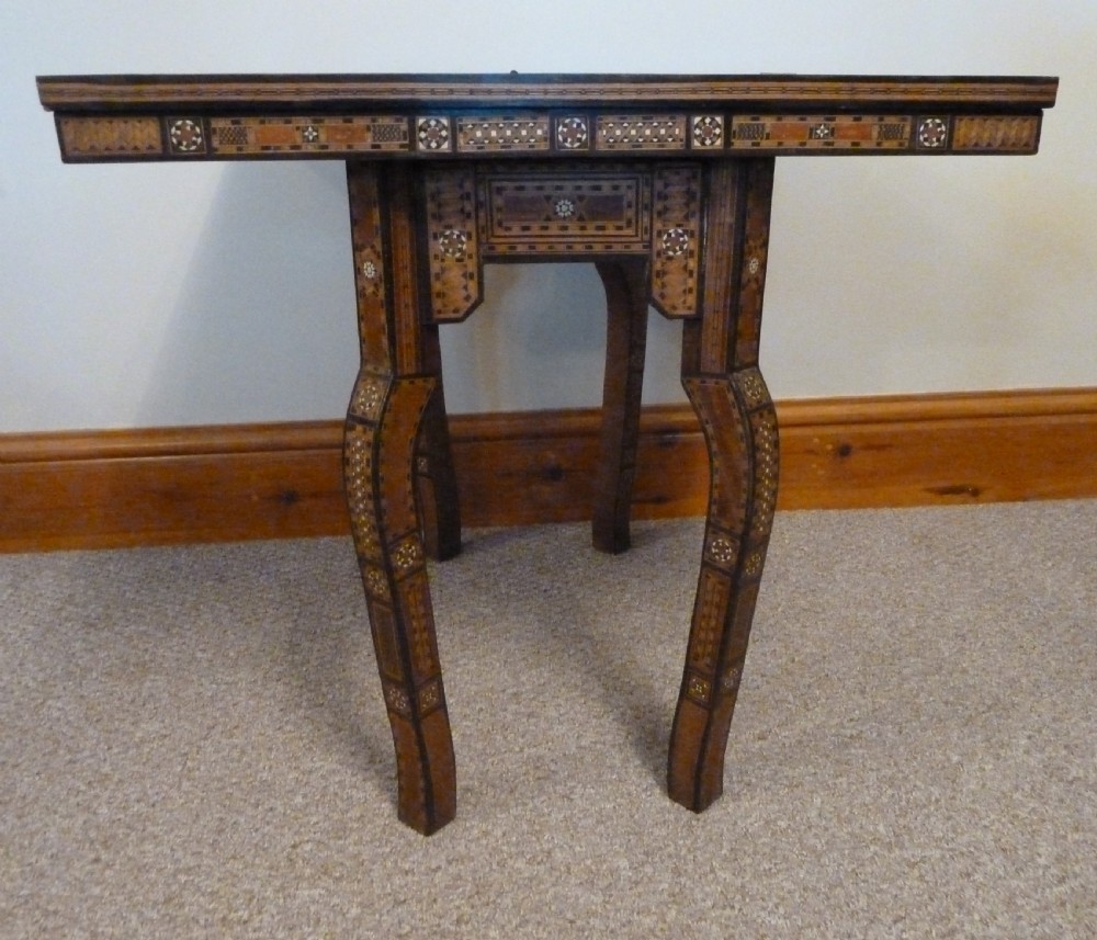 A Syrian Damascus card table featuring geometric wood and bone inlay work supported by curved cabriole legs. View IV