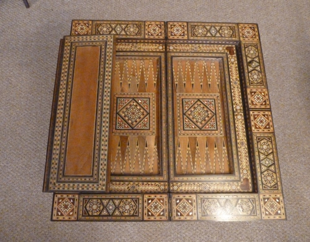 A Syrian Damascus card table featuring geometric wood and bone inlay work supported by curved cabriole legs. View VII