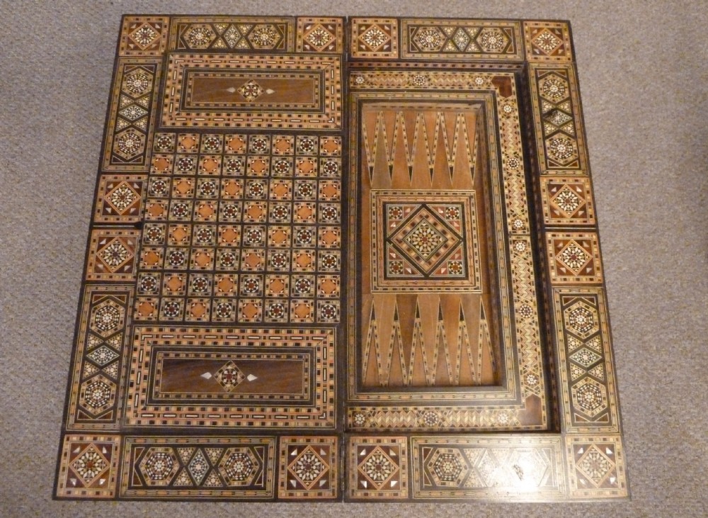 A Syrian Damascus card table featuring geometric wood and bone inlay work supported by curved cabriole legs. View VIII