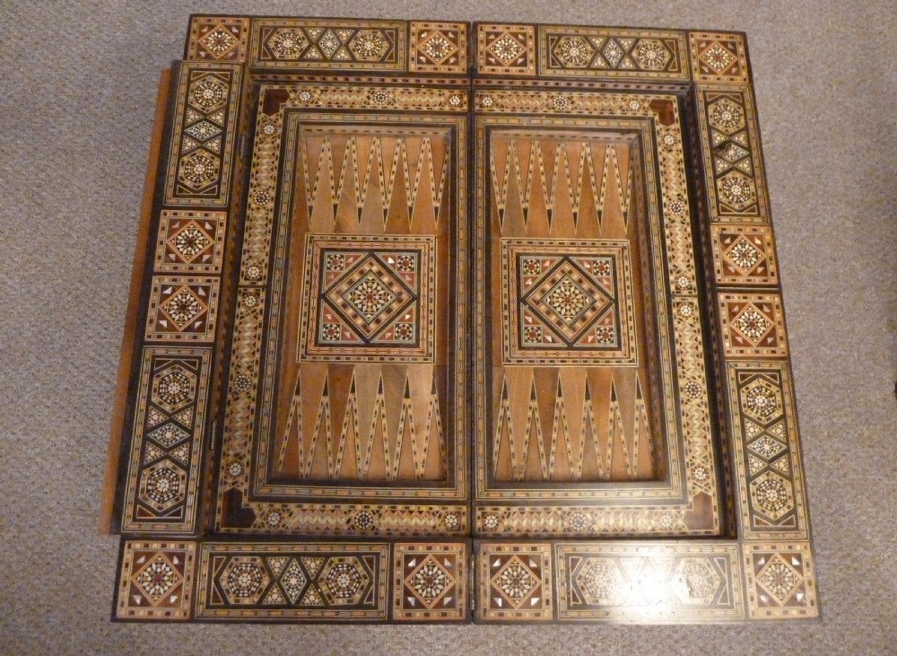 A Syrian Damascus card table featuring geometric wood and bone inlay work supported by curved cabriole legs. View IX