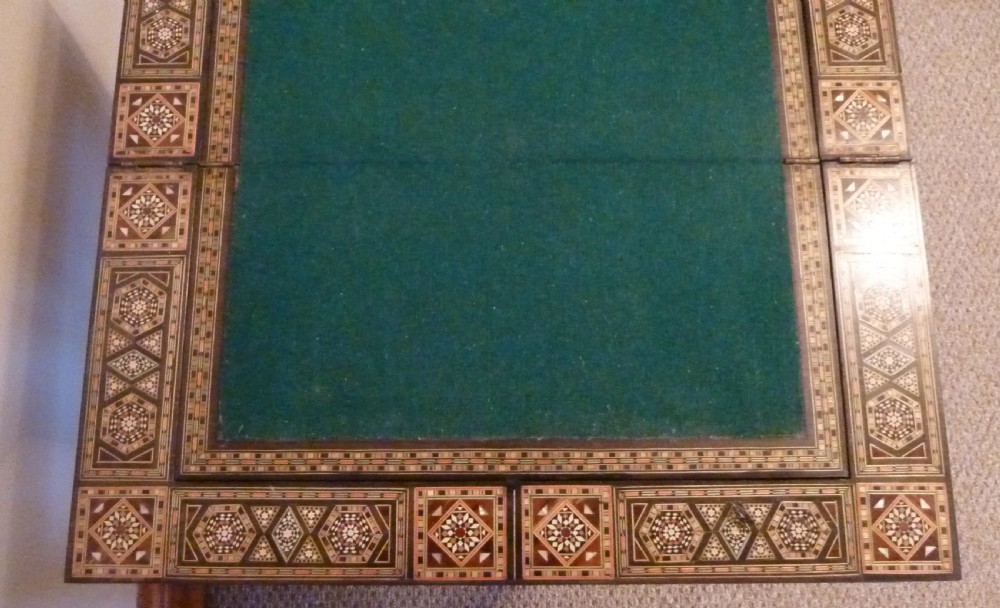 A Syrian Damascus card table featuring geometric wood and bone inlay work supported by curved cabriole legs. View XII