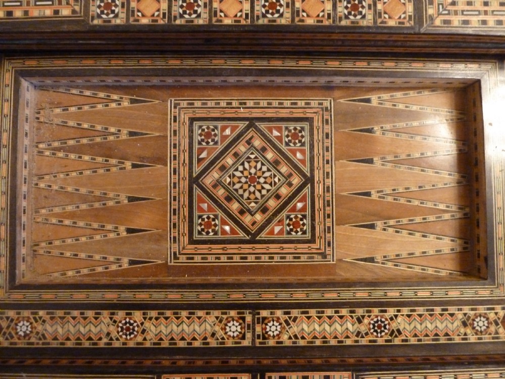 A Syrian Damascus card table featuring geometric wood and bone inlay work supported by curved cabriole legs. View XV
