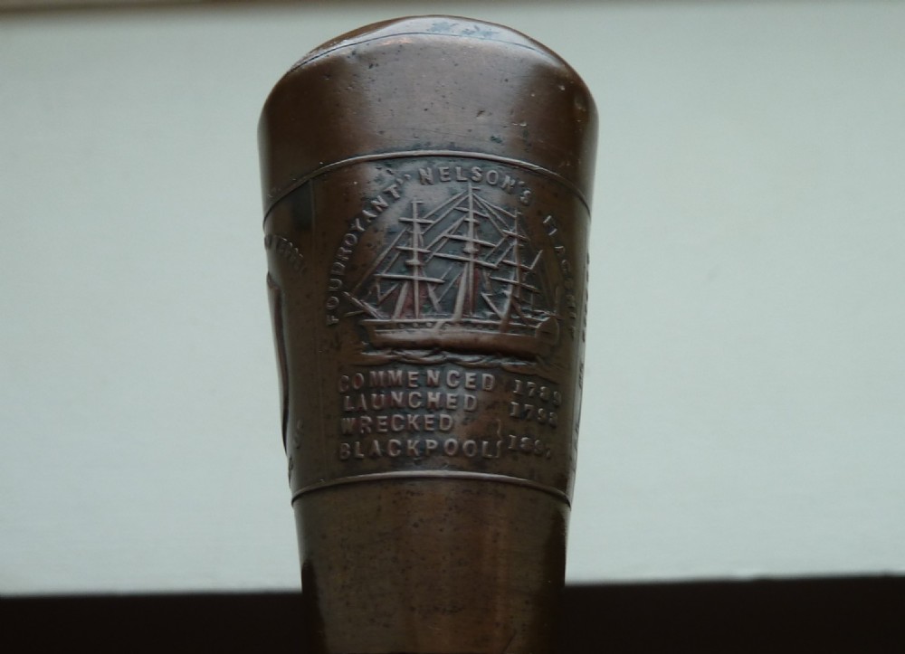 WALKING STICK AND COIN MADE FROM THE SALVAGED WRECK OF LORD NELSONS FIRST FLAGSIP THE FOUDROYANT