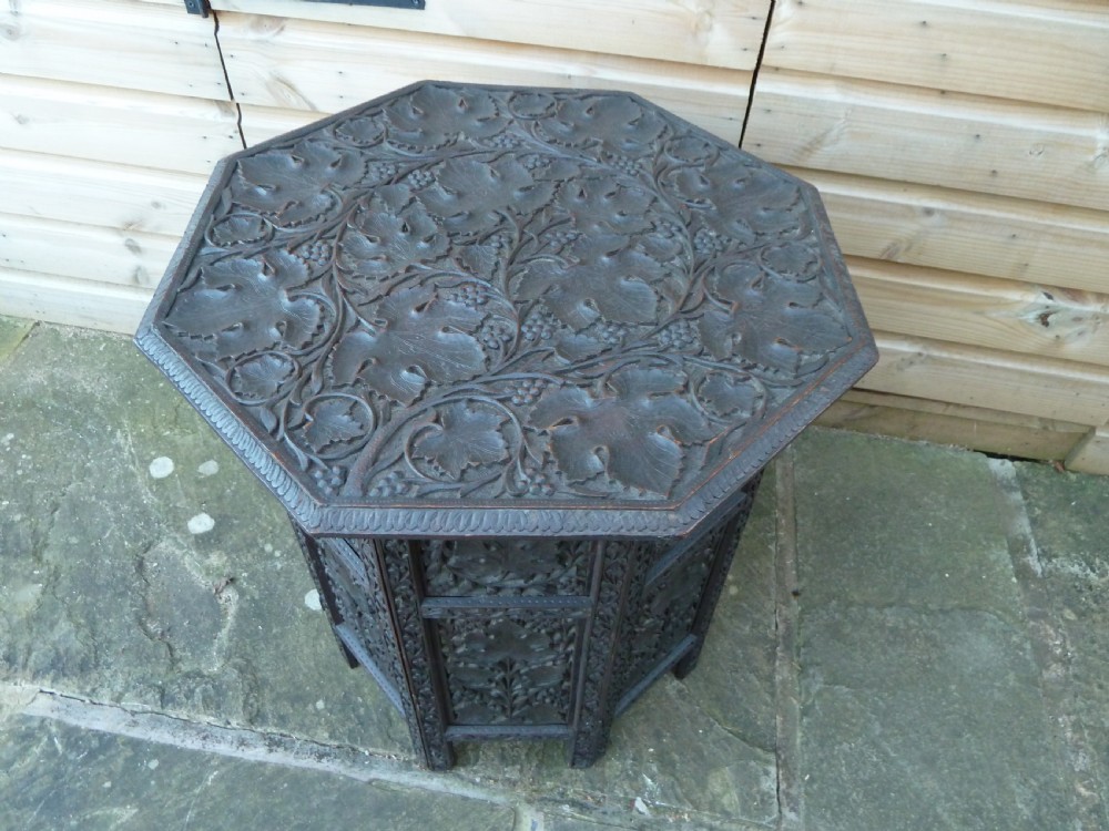 PROFUSELY CARVED INDIAN OCCASIONAL TABLE View VIII