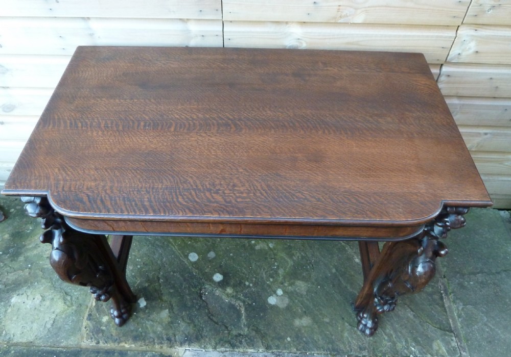 VICTORIAN OAK WRITING TABLE WITH GRIFFIN MOUNTS View III